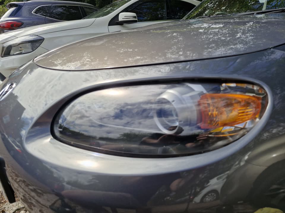 After: the same headlight, clear